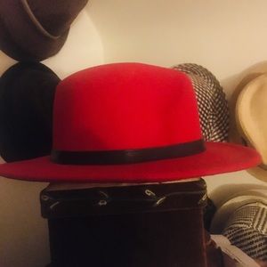 A beautiful red Fedor hat  with a black trim